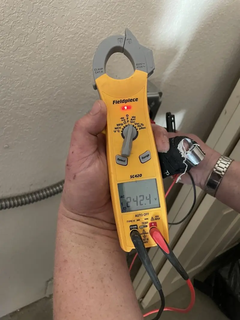 Voltage testing with clamp meter during Outlet Installation in Othello
